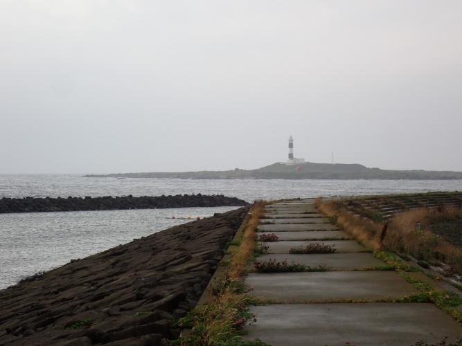 Cape Oma, the northernmost point of Honshu. On the other side of the Tsugaru Strait is the island of Honshu, which is visible on a clearer day.