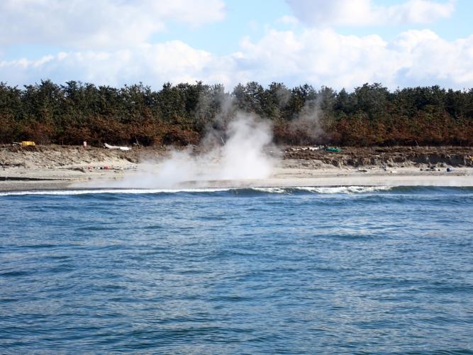 Steaming stream over beach