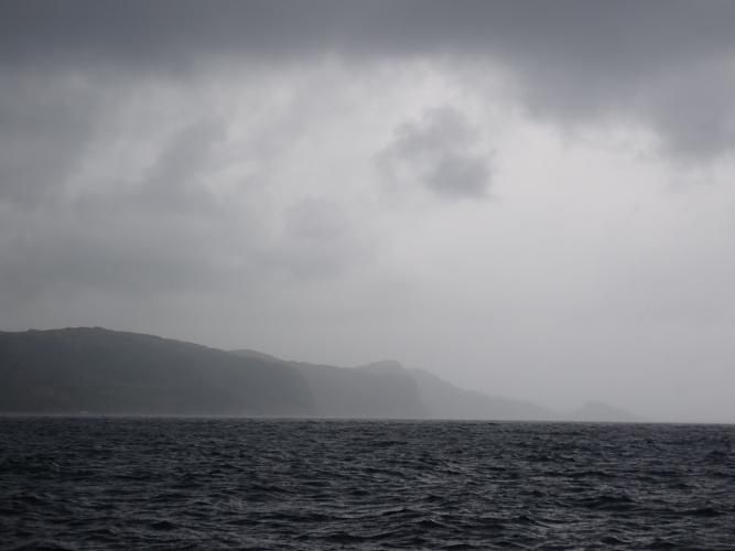 Rainy headland. Wind from behind once round the end...